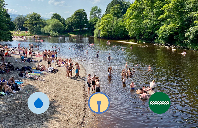 people bathing in a river